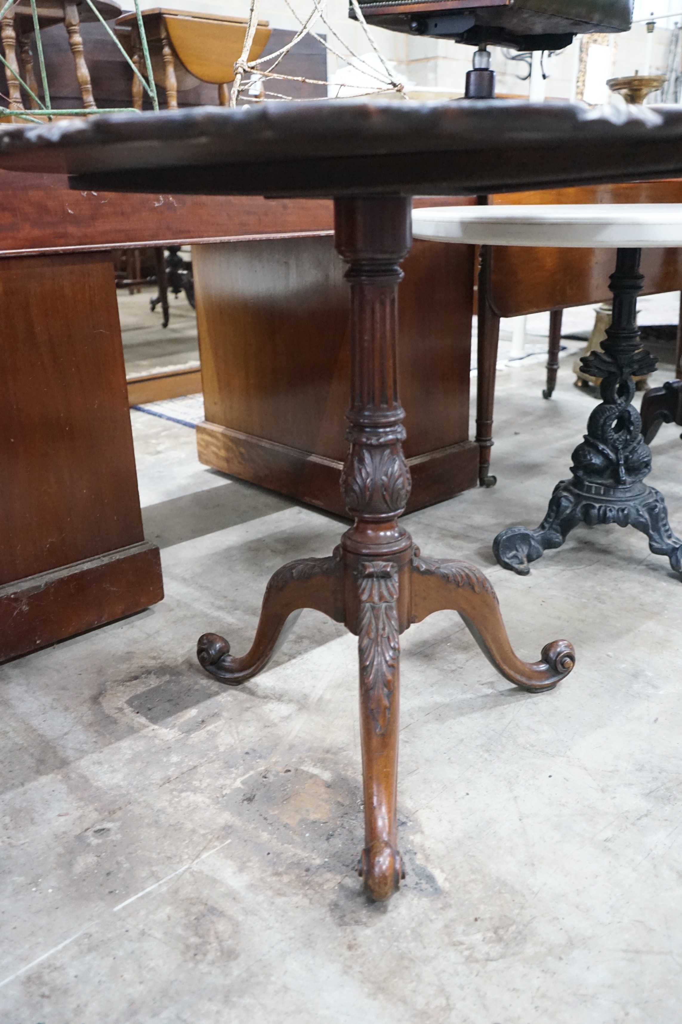 A George III style circular mahogany tilt top tripod tea table, diameter 81cm, height 74cm